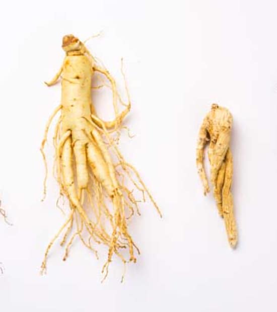 practicing yoga with ginseng tea on a table beside her